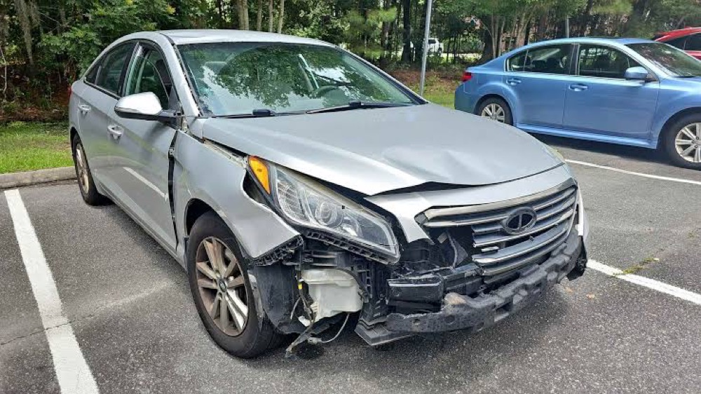 Silver sedan with front driver-side collision damage